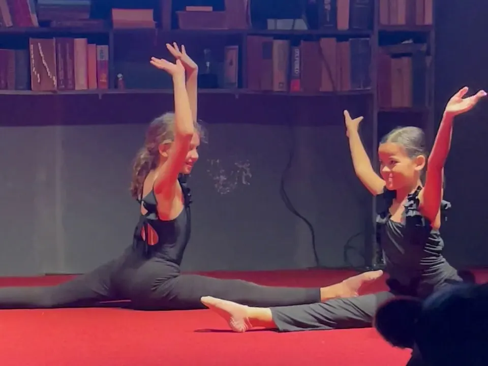 Two students performing a gymnastics routine at the Christmas Talent Show