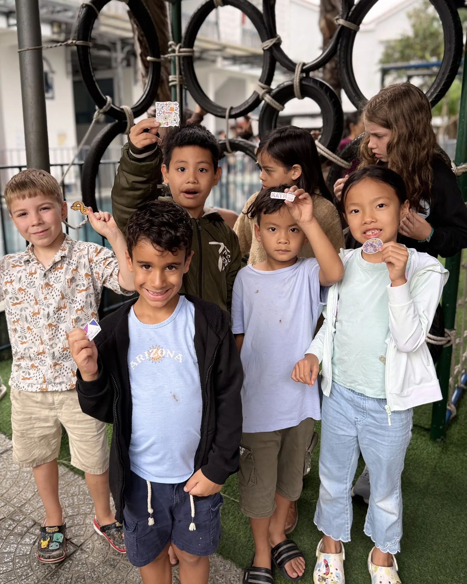 Students with the prize stickers they won at March Mathness