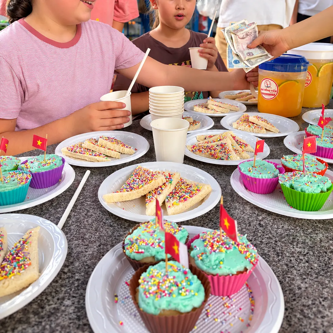 Students decorating cupcakes in a cooking class