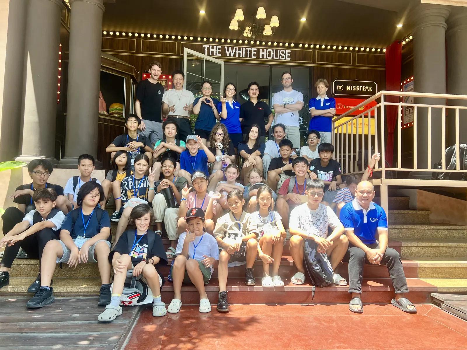 Students and teachers on the steps during Learning Without Walls