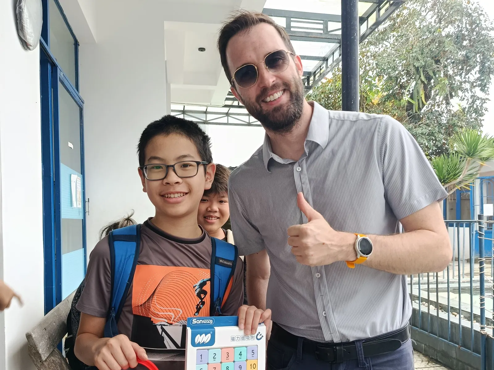 Mr. Bowen presenting the prize to the winner of the guess-how-many maths challenge at March Mathness