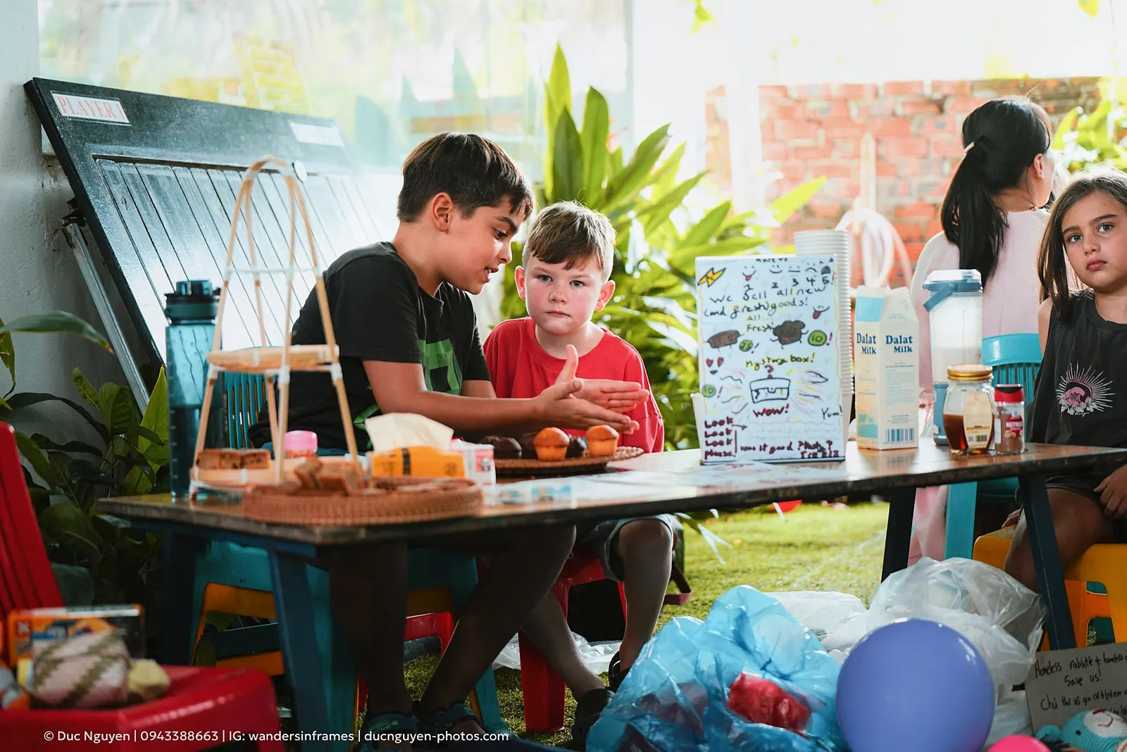 Two students running their snack stall at the Mid-Autumn Festival