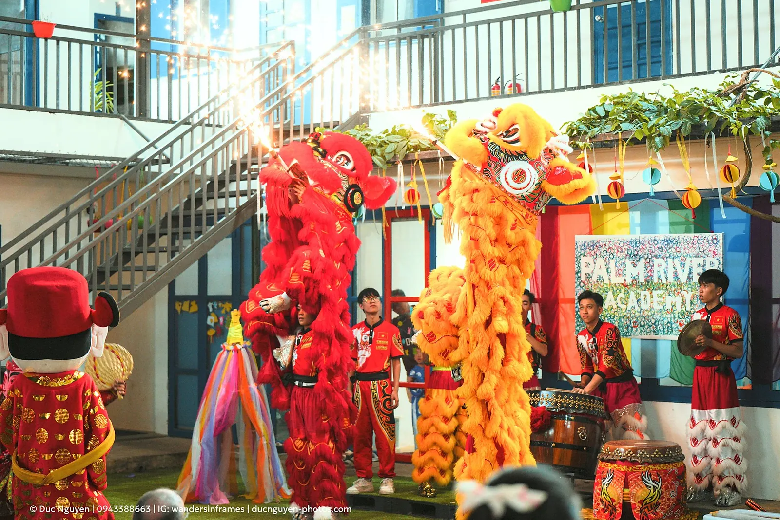 Two lions rearing face to face with sparklers at the Mid-Autumn Festival