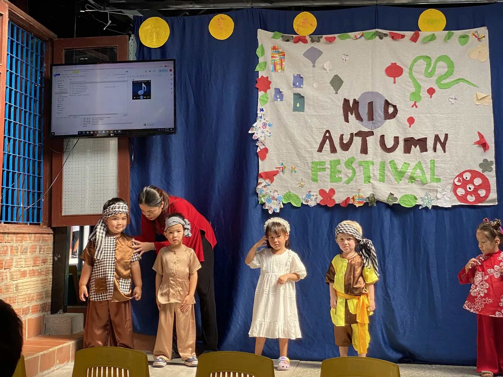 Early Years children in the costume parade at the Mid-Autumn Festival