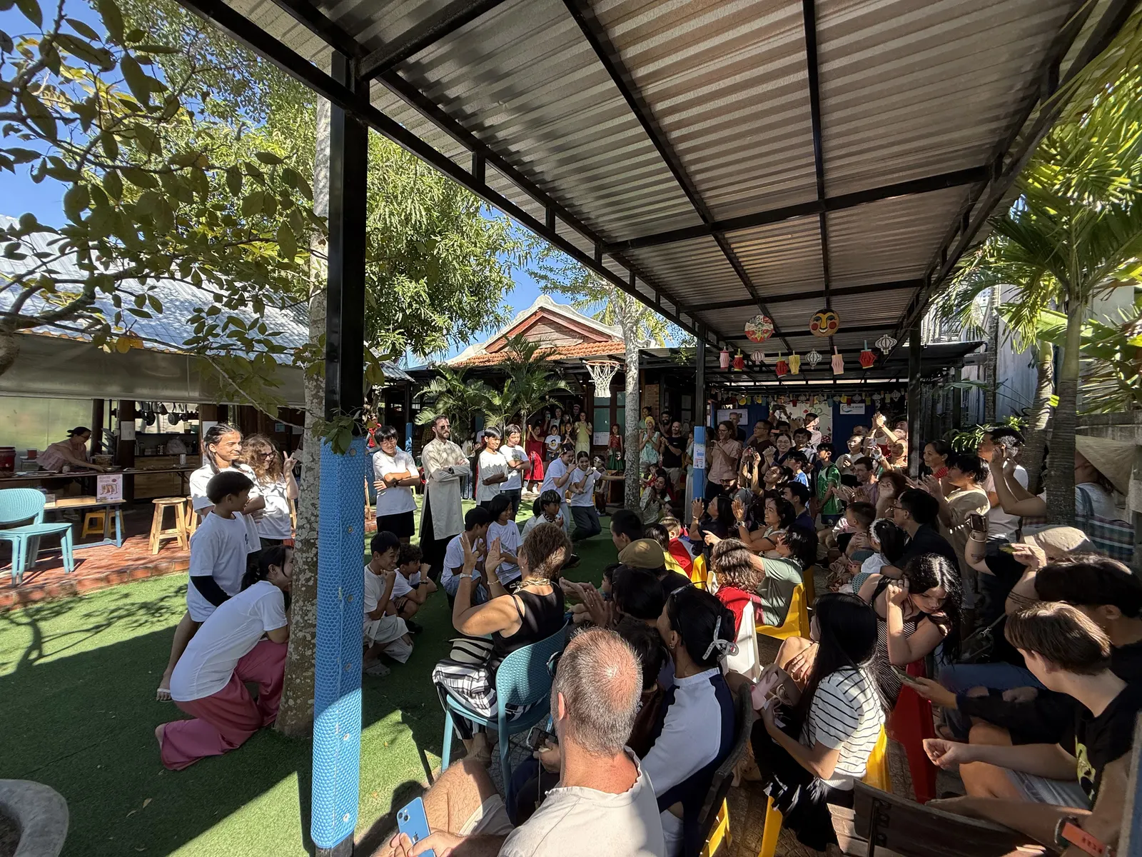 Families and students fill the courtyard for the Mid-Autumn Festival show