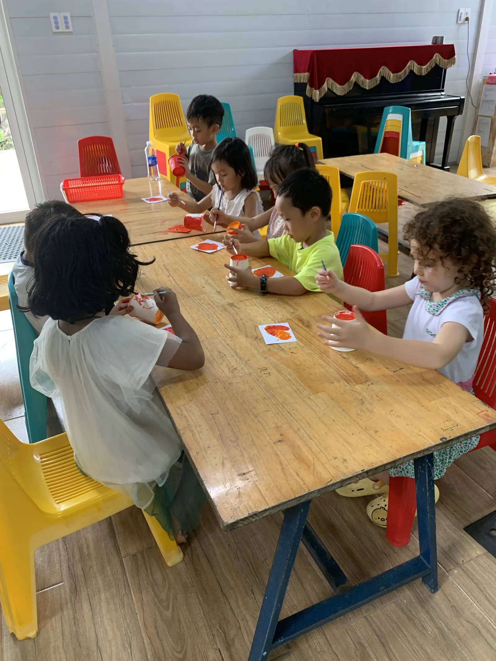 Primary students playing a card game at their table