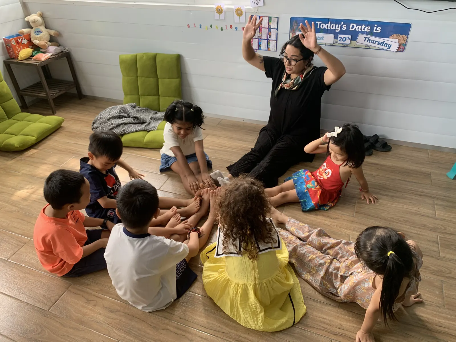 A Primary class puts their hands in together