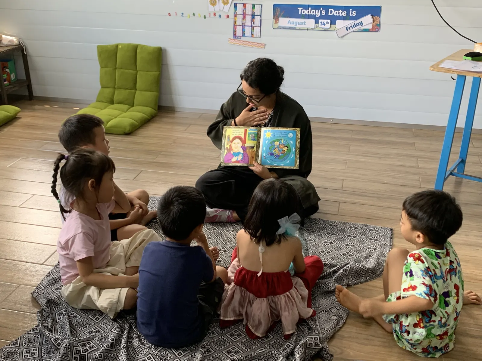 Story time on the rug with a Primary class
