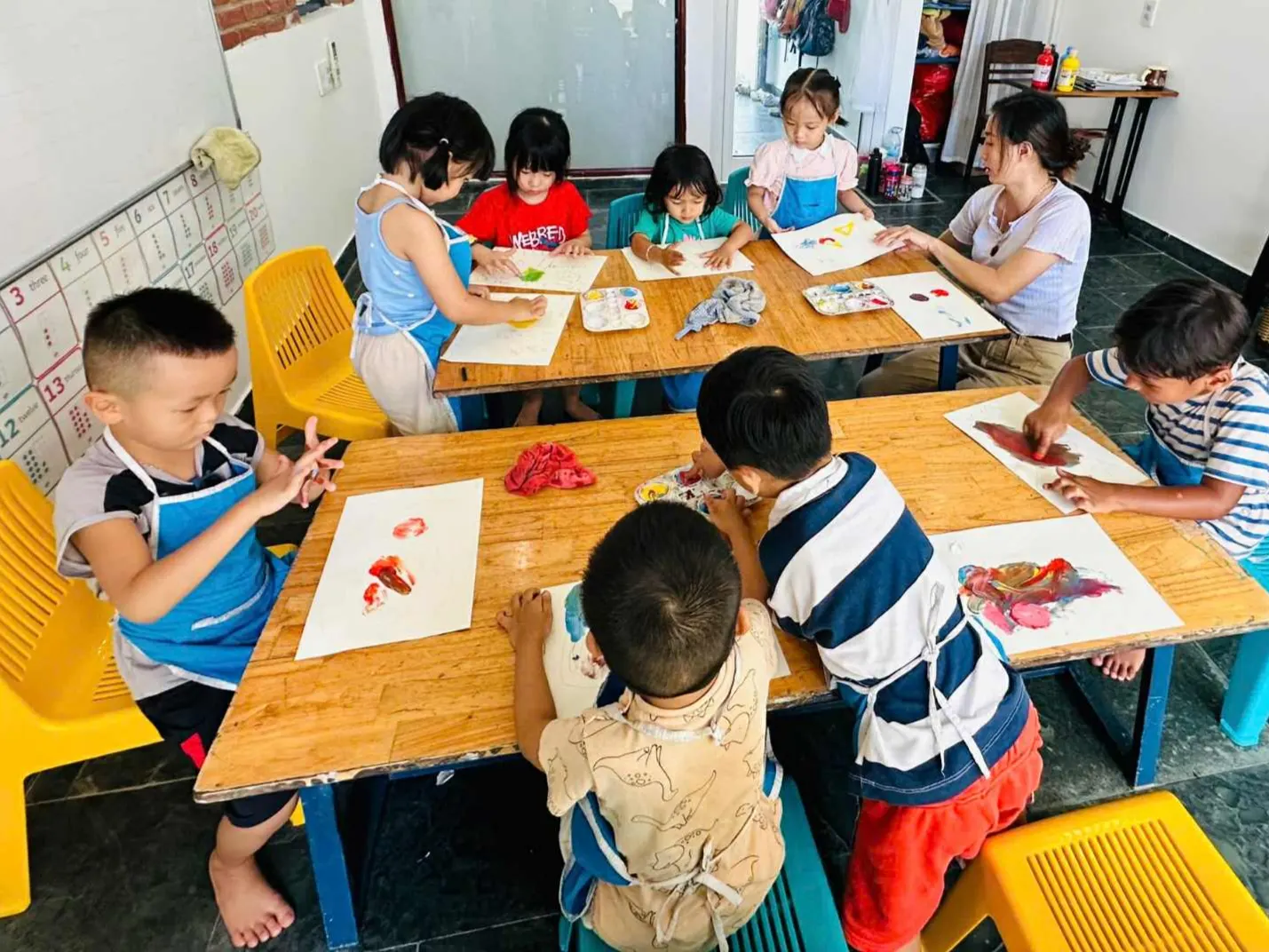 Primary students modeling clay in an art lesson