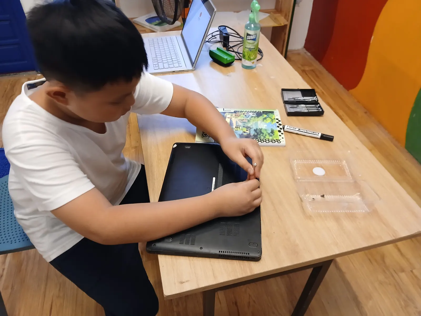 A Primary student working on a tablet in technology