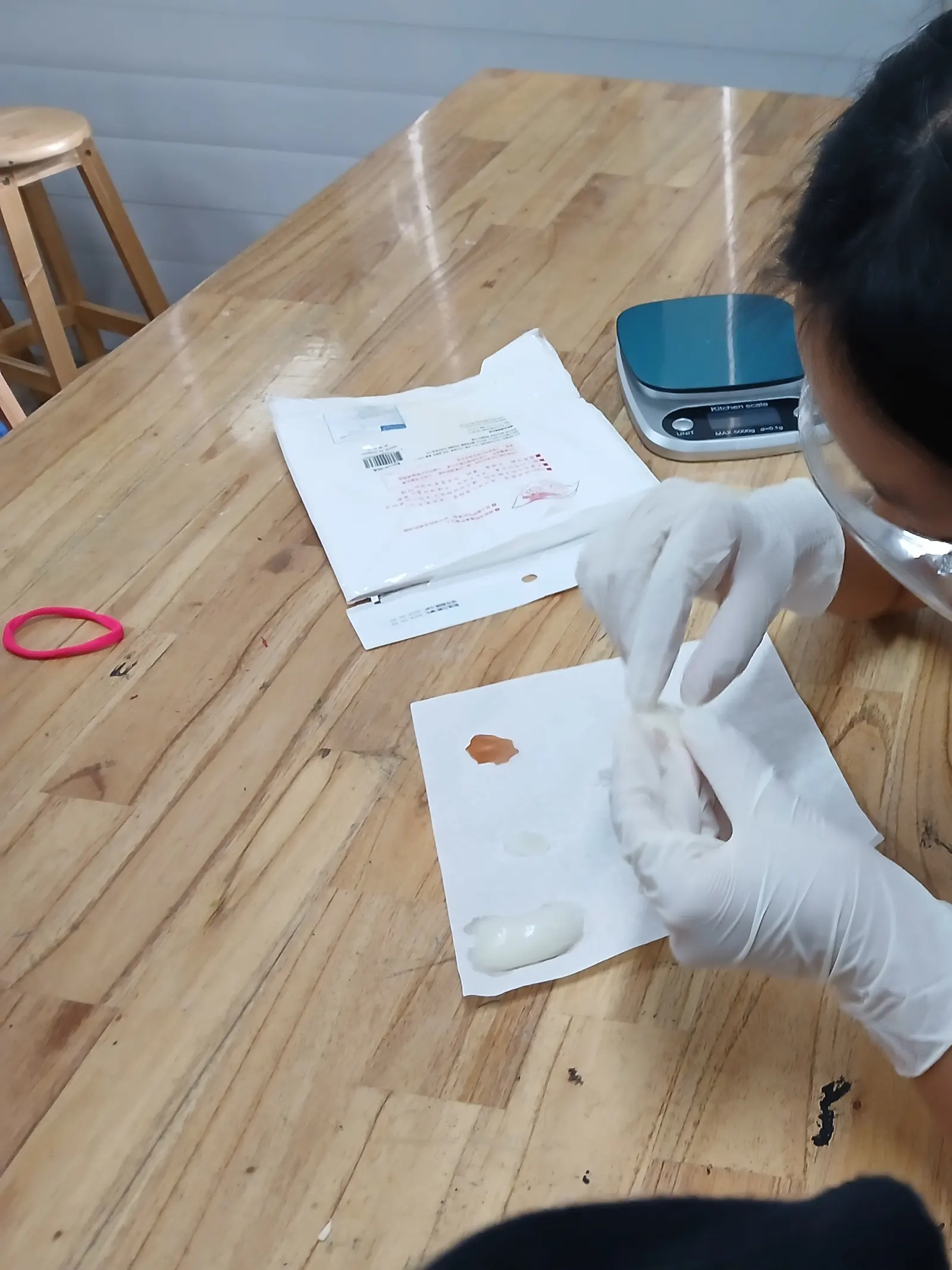 Weighing a sample on the balance during a Lower Secondary science practical