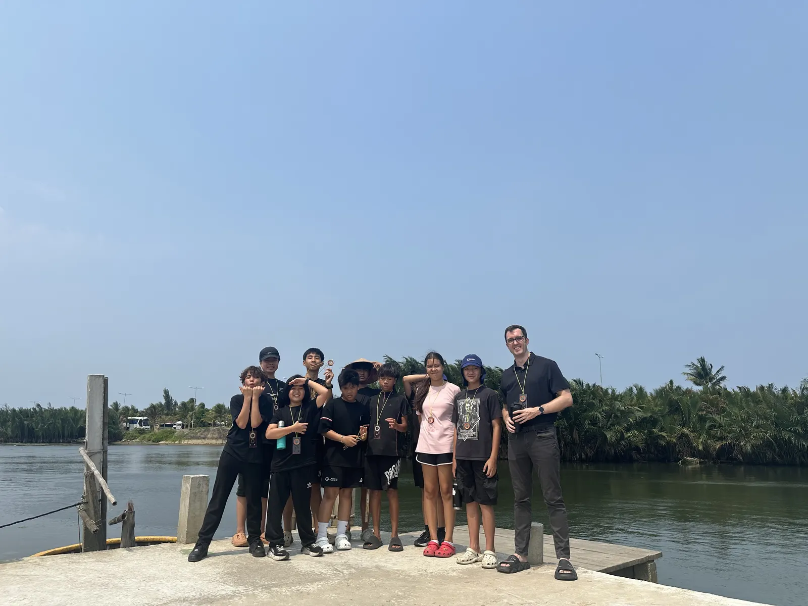 Mr. Bowen and his Secondary class at the end of a nature walk by the river