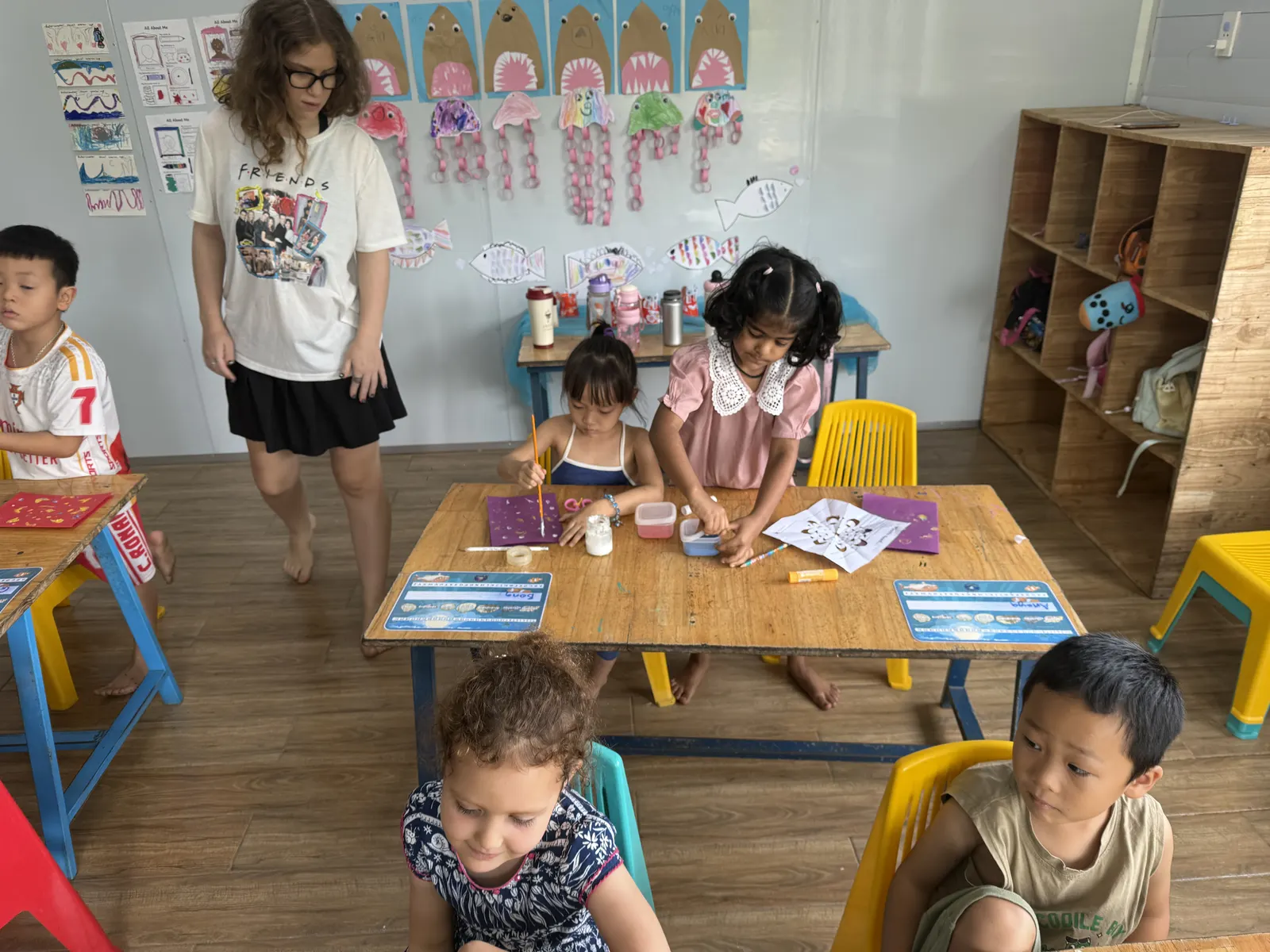 An Upper Secondary student helping out in a Primary class