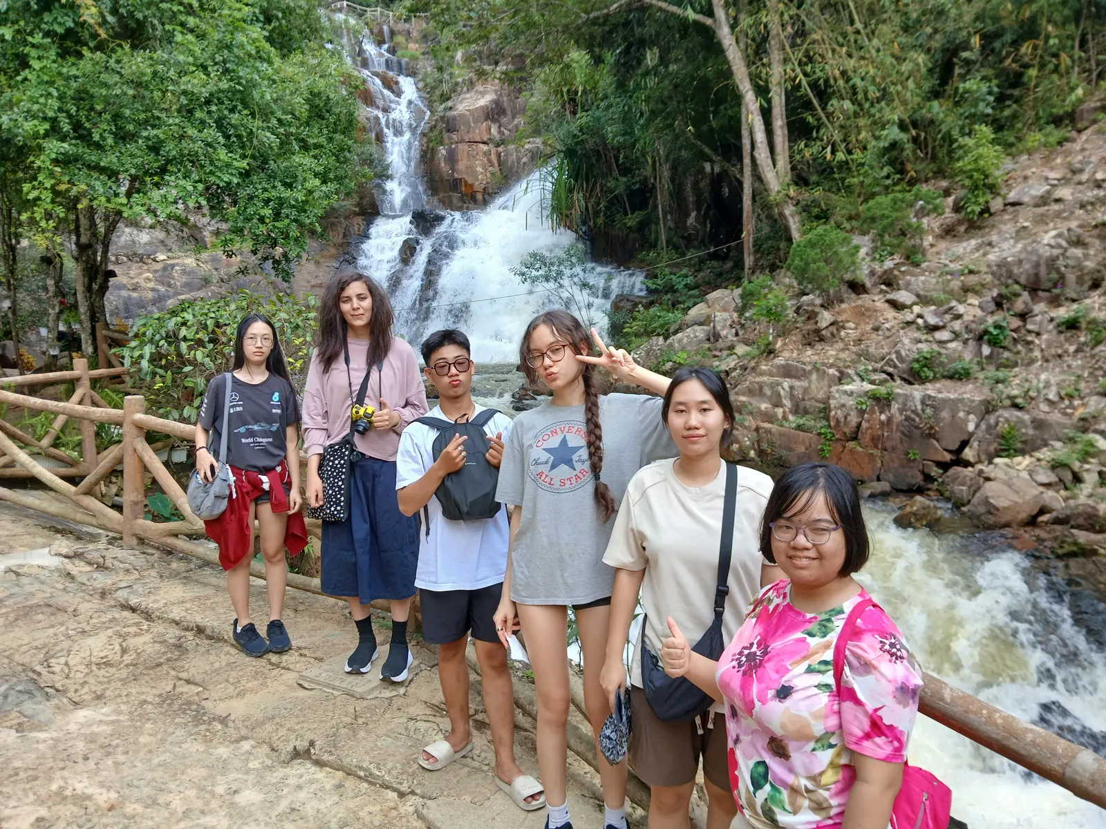Palm River Academy students and their teacher on a field trip to a waterfall near Hội An