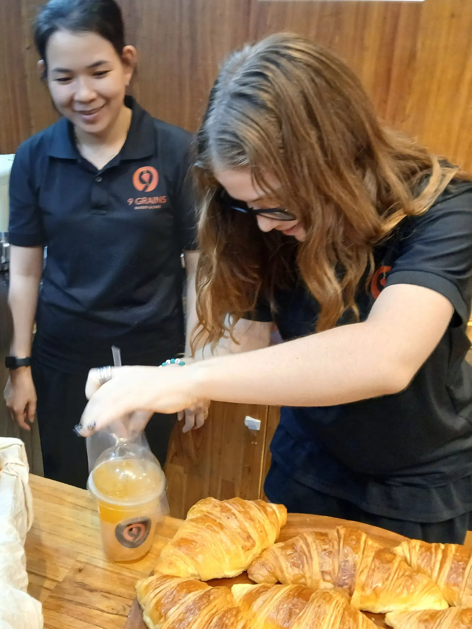 An Upper Secondary student pouring a drink on an internship shift at a Hội An bakery