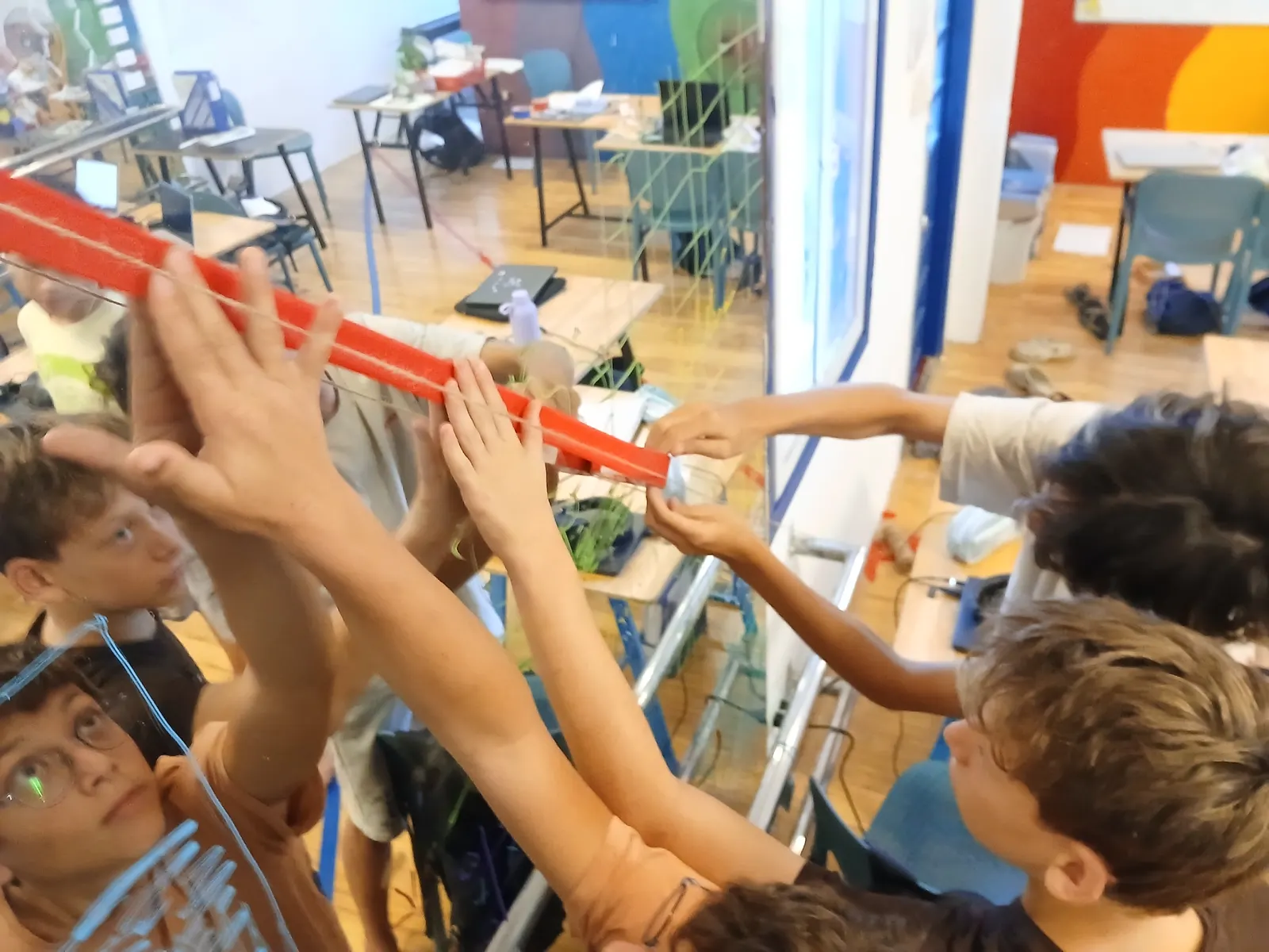 Holding the level steady to take a measurement in an Upper Secondary maths lesson